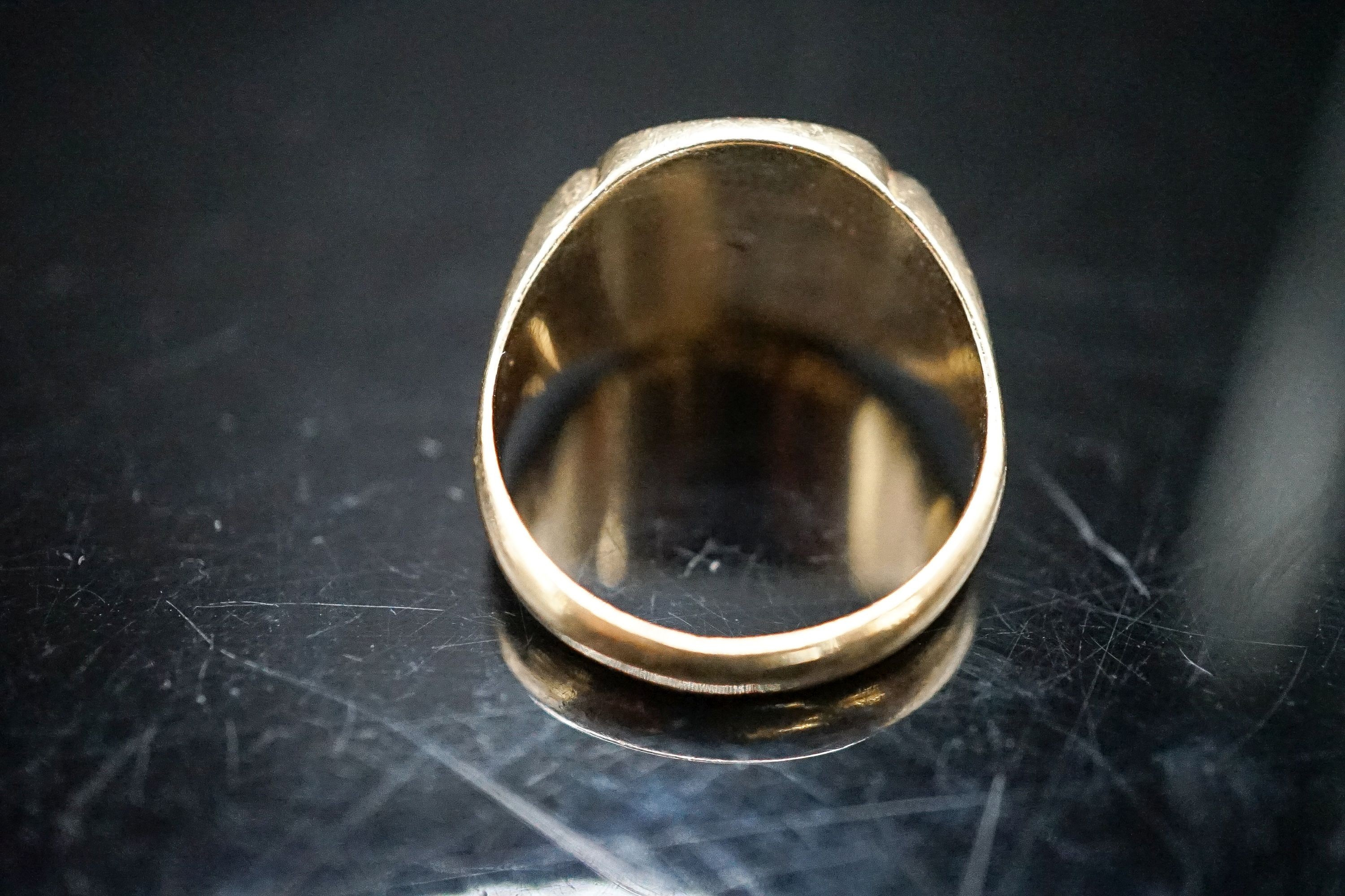 A modern 9ct gold and diamond chip set signet ring, size O/P, gross 6.9 grams.